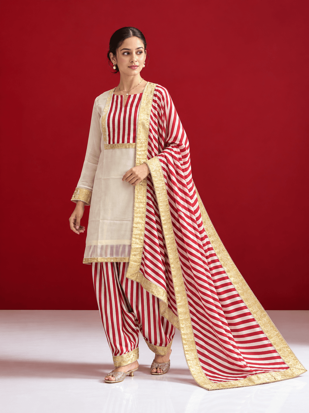 Ivory organza kurta with stripped satin salwar and dupatta
