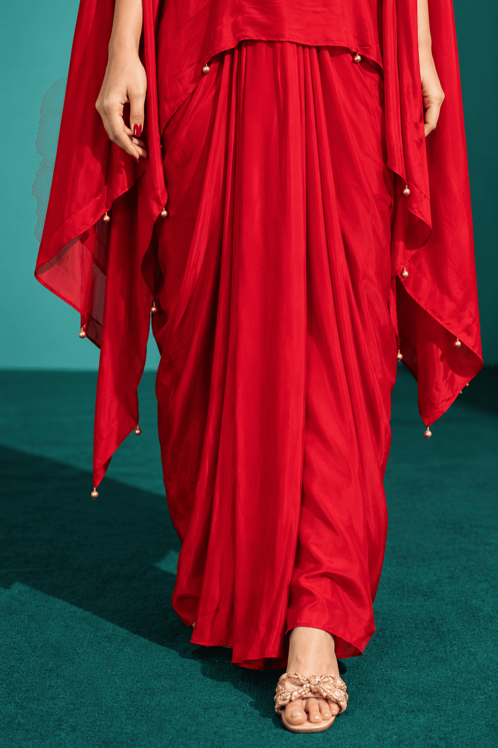 Red crepe draped skirt with embroided cape