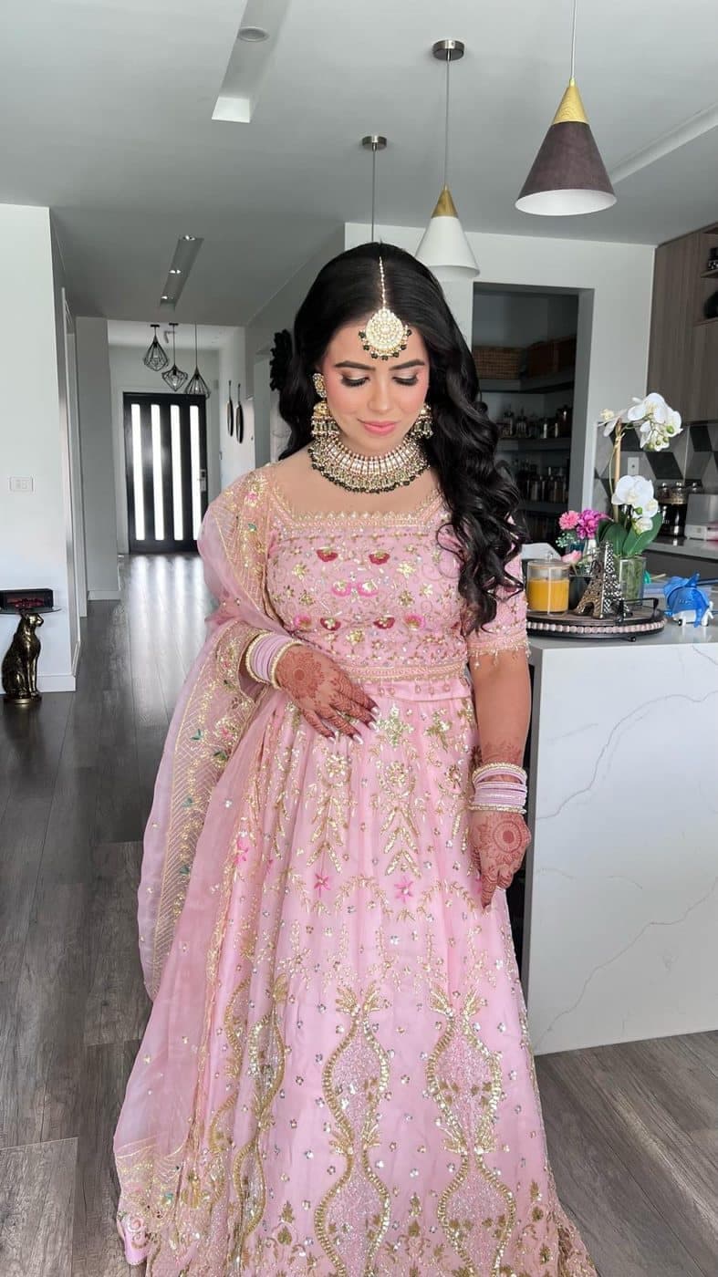 A customer wearing an outfit made at The Shree Boutique