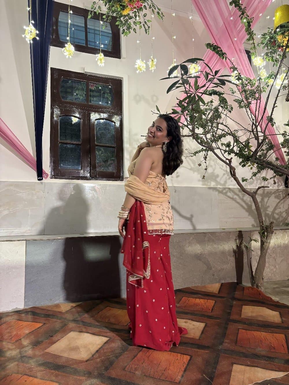 A customer wearing an outfit made at The Shree Boutique